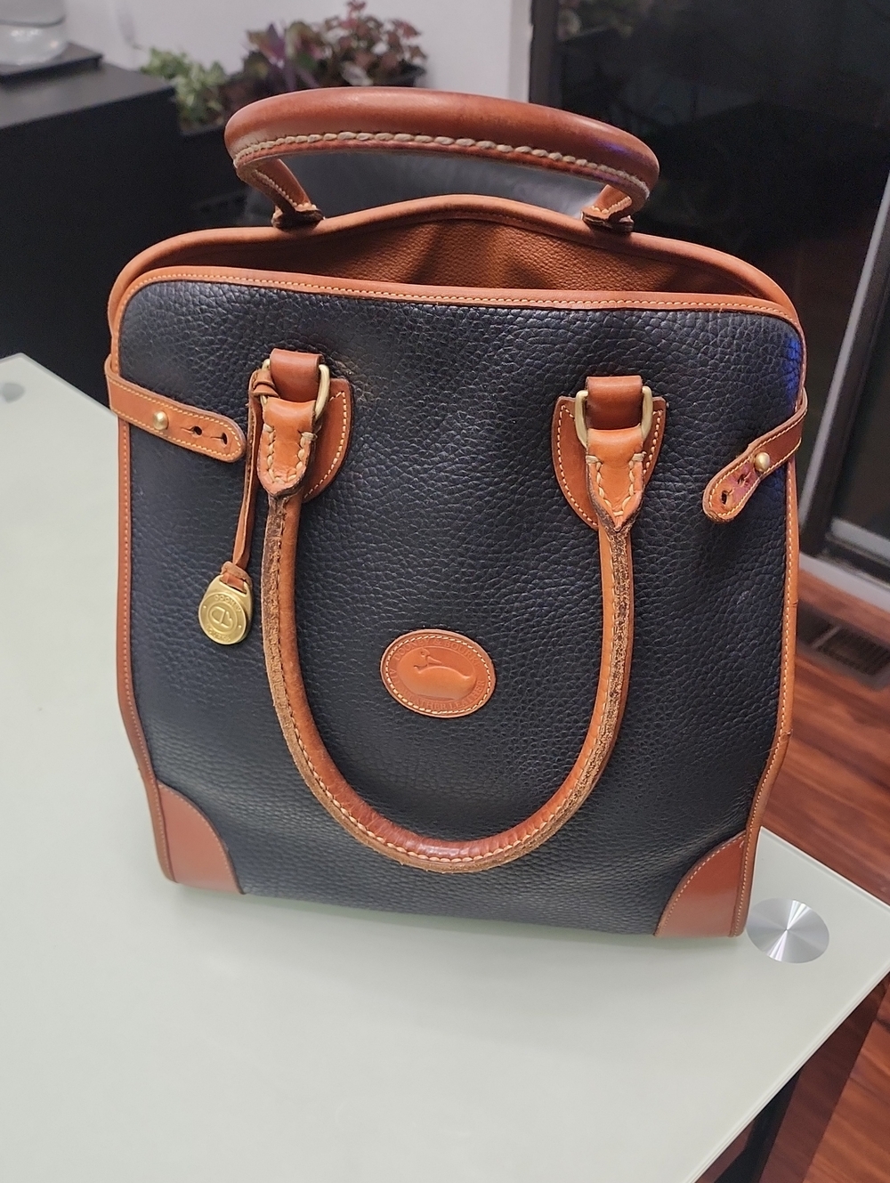 Dooney & Bourke Vintage Black Leather Satchel with Brown Trim